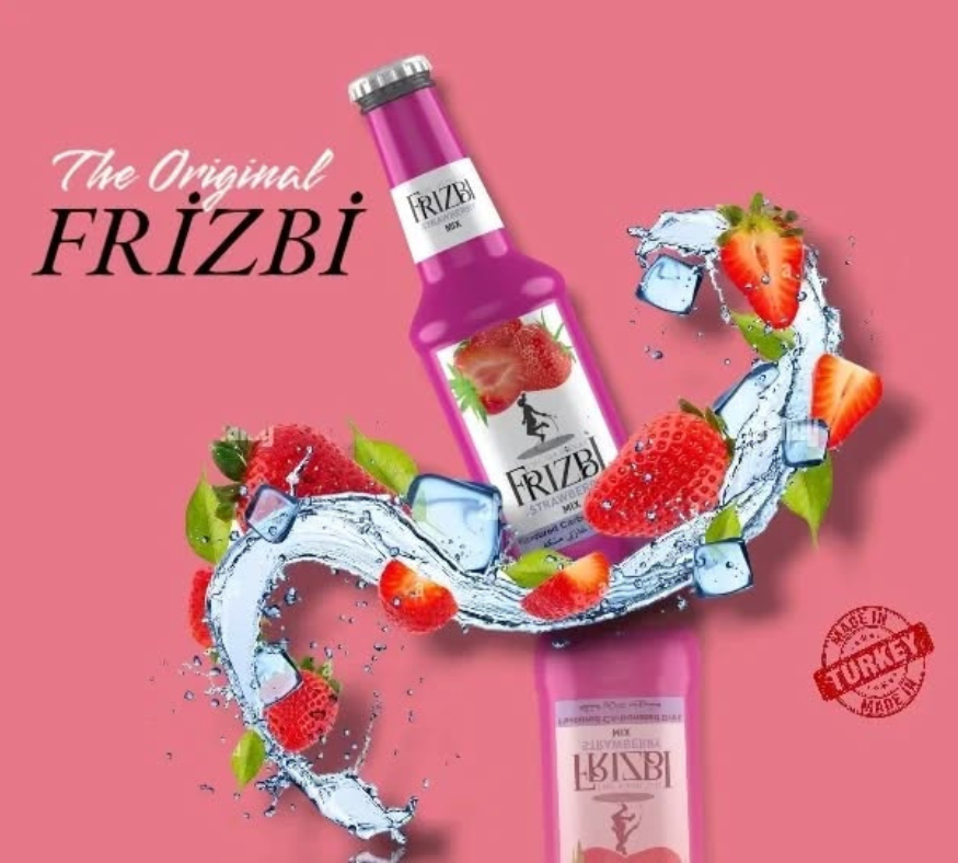 Frizbi strawberry flavored soft drink bottle with splashing water and fresh strawberries on a pink background.